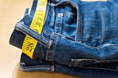 A pair of jeans and tape measure