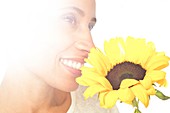 Woman holding sunflower