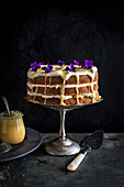 Lemon Curd and Creme Fraiche cake, decorated with violets