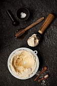 Salted Honey Ice Cream in a tub and scoop