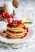 Pancakes with redcurrants and syrup
