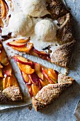 A galette with peach, nectarine and plum served with vanilla ice cream