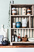 Crockery on open-fronted wooden shelves