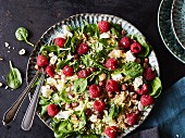 Couscous salad with spinach and raspberries