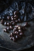 Vegan cashew nuts coated in dark chocolate