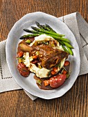 Braised lamb shanks with mashed potato and asparagus