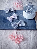 Garland with tissue paper bows on stone platter