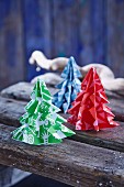 Patterned paper Christmas trees on wooden boards