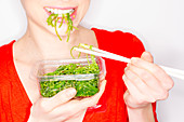 Woman eating edible seaweed