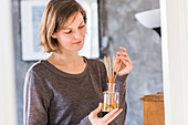 Woman holding an aroma stick