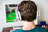 Teenager playing videogames