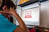 Teenage boy using a computer