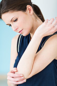 Woman suffering from elbow pain
