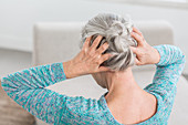Woman massaging her scalp