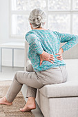 Woman suffering from lumbar pain
