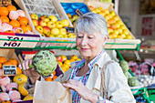 Senior woman buying fruits and vegetables