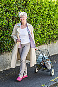 Senior woman with shopping cart