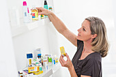 Woman sorting old medicines