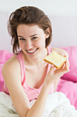 Woman eating toast