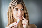 Woman applying an ointment