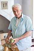 Man preparing artichokes