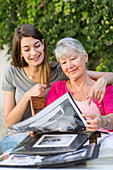 Women looking at photo album