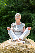 Senior woman in the lotus position