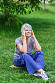 Woman resting in meadow