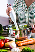 Woman making soup