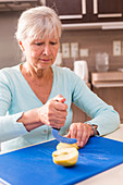 Woman using an ergonomic knife