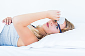 Woman wearing eye shades sleep mask