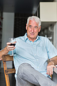 Senior man drinking wine