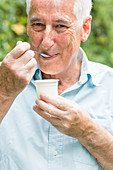 Man eating yogurt