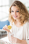 Woman drinking lemon juice