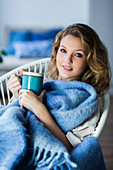 Woman drinking hot beverage