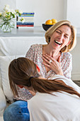 Woman laughing with her daughter