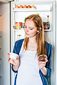Woman checking nutrition facts