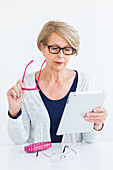 Woman looking online for eyeglasses