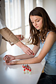 Teenage girl undergoing skin prick test