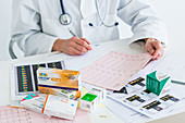 Doctor writing a medical prescription