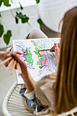 Woman colouring a mandala