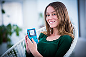Woman playing with video game console