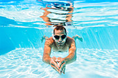 Man swimming in pool