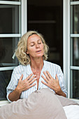 Woman doing breathing exercises