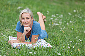 Woman relaxing on grass