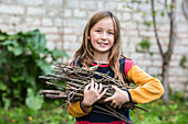 Child collecting firewood