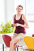 Woman drinking hot beverage