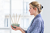 Woman burning incense