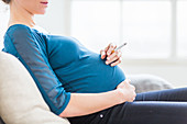 Pregnant woman smoking a cigarette