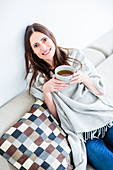 Woman drinking hot beverage